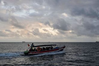 A boat departs to Colombia from Gardi Sugdub on Panama's Caribbean coast, Monday, Feb. 24, 2025, carrying Venezuelan migrants on their way back from southern Mexico after giving up hopes of reaching the US as President Trump cracks down on migration.