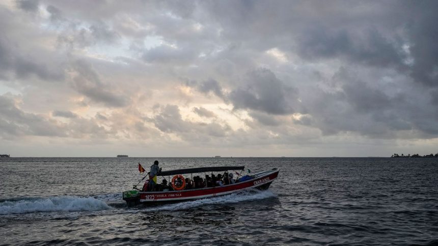 A boat departs to Colombia from Gardi Sugdub on Panama's Caribbean coast, Monday, Feb. 24, 2025, carrying Venezuelan migrants on their way back from southern Mexico after giving up hopes of reaching the US as President Trump cracks down on migration.