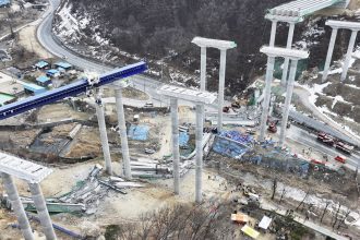 Elevated parts of a highway under construction collapsed on Tuesday in Cheonan, South Korea.