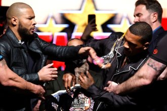 Chris Eubank Jr. strikes Conor Benn with an egg during a press conference in Manchester on February 25.