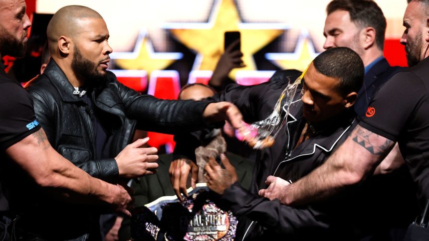 Chris Eubank Jr. strikes Conor Benn with an egg during a press conference in Manchester on February 25.