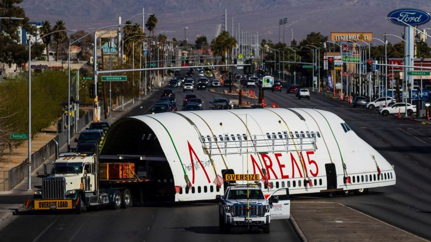 A section of a 747 airplane moves through Las Vegas streets on the way to a new home at Area 15 where it will be part of an immersive art display, on Wednesday, Feb. 26, 2025.