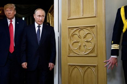 President Donald Trump, left, and and Russia President Vladimir Putin arrive for a meeting in Helsinki on July 16, 2018.