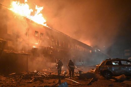 Rescuers of the State Emergency Service work to extinguish a fire in a building after a drone strike in Kharkiv, Ukraine, on January 28.