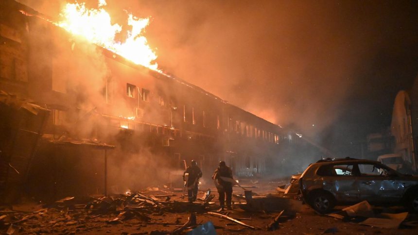 Rescuers of the State Emergency Service work to extinguish a fire in a building after a drone strike in Kharkiv, Ukraine, on January 28.