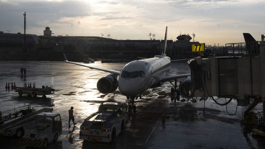 A plane sits on the tarmac at LaGuardia Airport in New York.