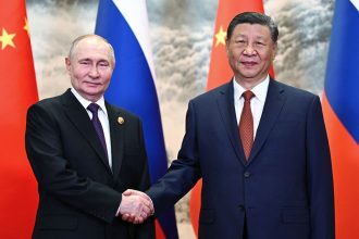 Russia's President Vladimir Putin and Chinese leader Xi Jinping shake hands prior to their talks in Beijing on May 16, 2024.