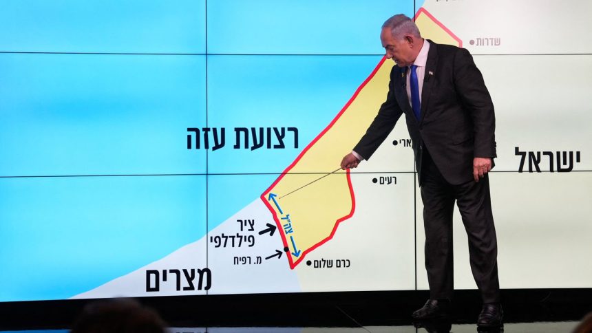 Israeli Prime Minister Benjamin Netanyahu indicated the Gaza-Egypt border during a news conference in Jerusalem on September 2.