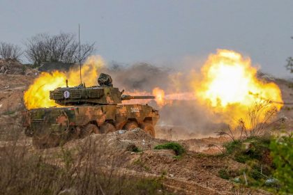 An assault vehicle unit carries out a fire strike during actual combat training in Ningbo, China, on January 10, 2025.