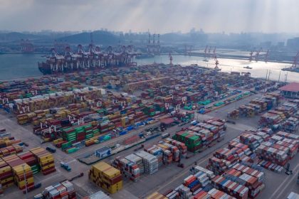 Ships are loaded at the container terminal of the port in Qingdao, in China's eastern Shandong province on January 25, 2025.