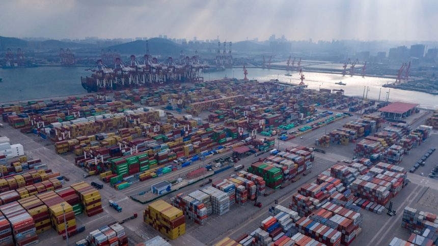 Ships are loaded at the container terminal of the port in Qingdao, in China's eastern Shandong province on January 25, 2025.