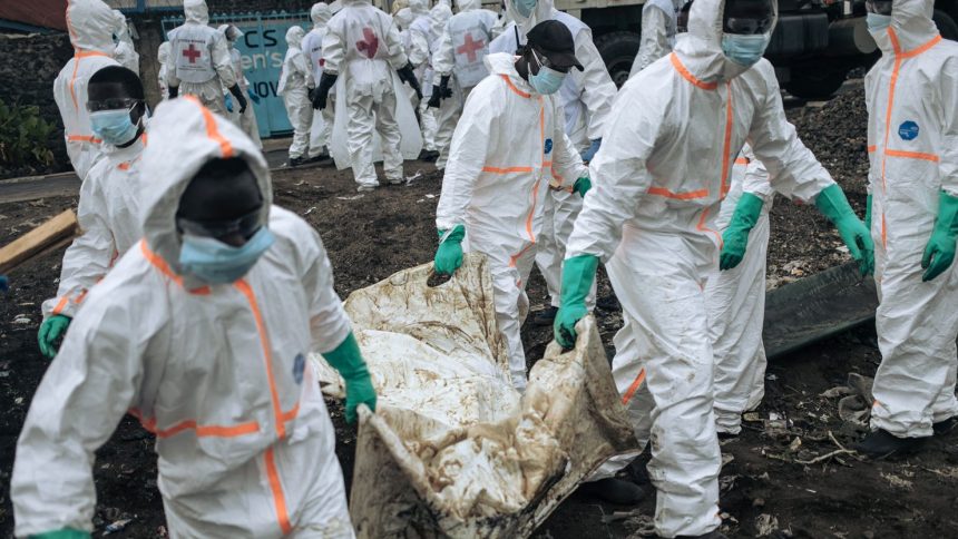 Members of the Congolese Red Cross and Civil Protection bury victims of the recent clashes in a cemetery in Goma, eastern DRC, on February 3, 2025.