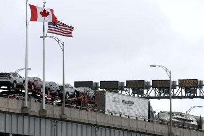 Commercial trucks cross the Lewiston-Queenston Bridge border crossing into the United States,