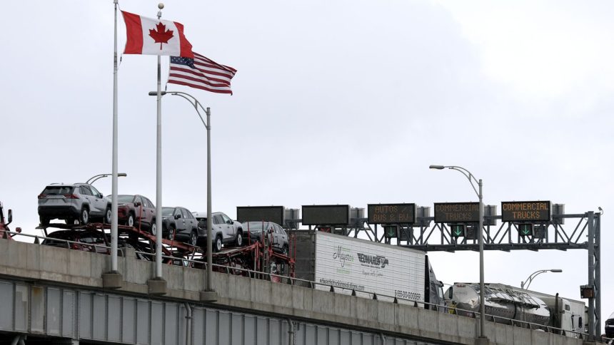 Commercial trucks cross the Lewiston-Queenston Bridge border crossing into the United States,