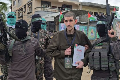 DEIR AL BALAH, GAZA - FEBRUARY 8: Israeli hostages Or Levy, Eli Sharabi, and Ohad Ben Ami being handed over to the International Committee of the Red Cross by the fighters of the Palestinian resistance group Hamas under a ceasefire and prisoner exchange agreement with Israel, in Deir al Balah, Gaza, on February 8, 2025. (Photo by Ashraf Amra/Anadolu via Getty Images)