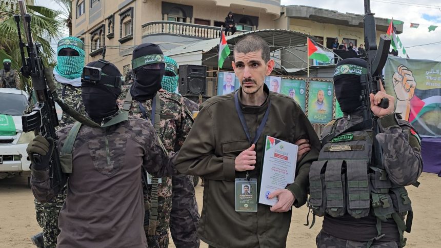 DEIR AL BALAH, GAZA - FEBRUARY 8: Israeli hostages Or Levy, Eli Sharabi, and Ohad Ben Ami being handed over to the International Committee of the Red Cross by the fighters of the Palestinian resistance group Hamas under a ceasefire and prisoner exchange agreement with Israel, in Deir al Balah, Gaza, on February 8, 2025. (Photo by Ashraf Amra/Anadolu via Getty Images)