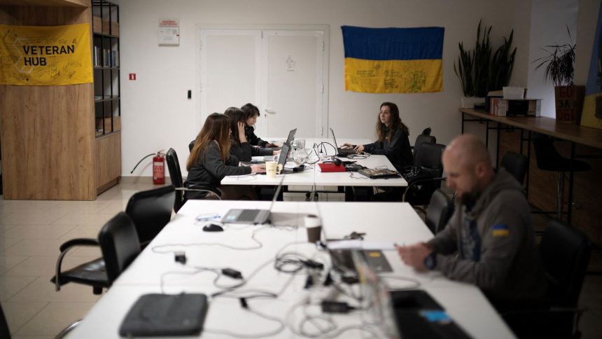 Staff at the Ukrainian NGO Veteran Hub work at the organization's office in Vinnystsia, Ukraine.