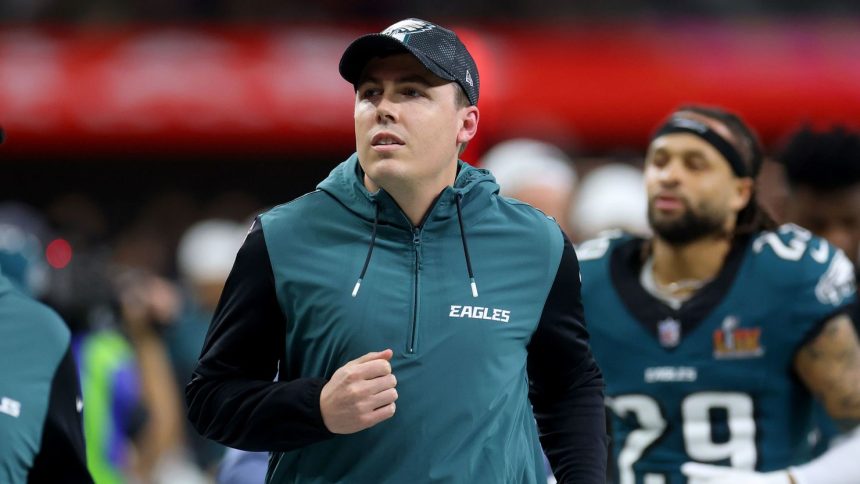 Offensive coordinator Kellen Moore jogs off the field at halftime before the Philadelphia Eagles' Super Bowl LIX victory over the Kansas City Chiefs at Caesars Superdome in New Orleans.