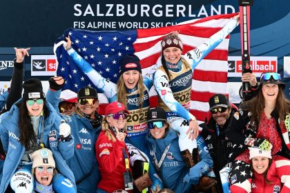 Shiffrin and Breezy Johnson (center) celebrate world championships gold in the women's team combined event.