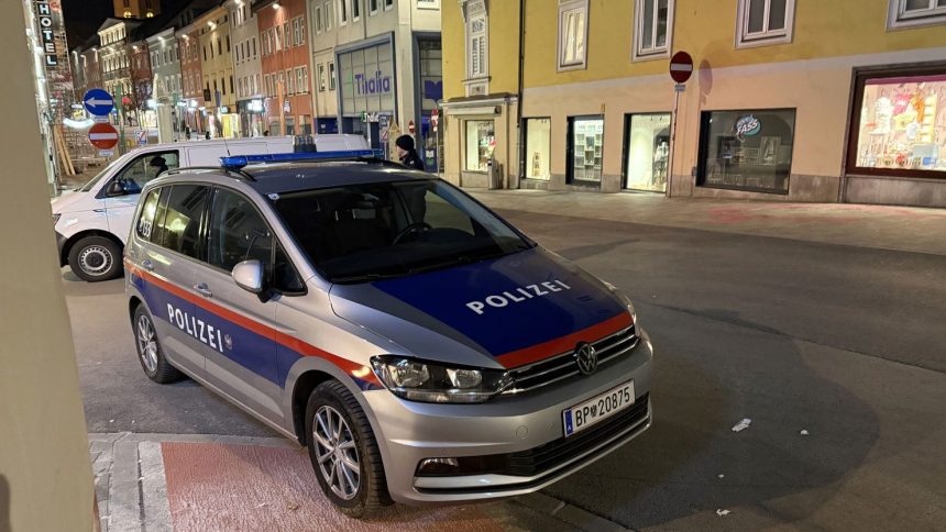 Police are seen after a knife attack near the main square in the city centre of Villach, southern Austria on February 15, 2025.