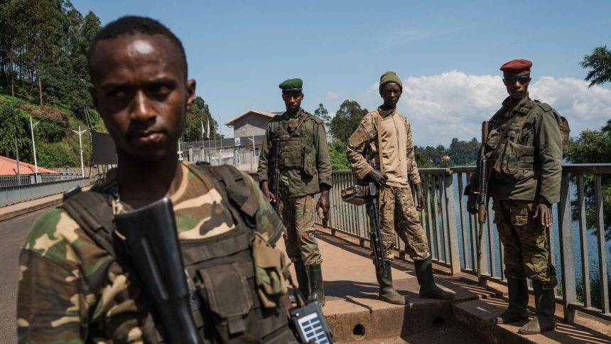 M23 rebel troops arrive at the Rusizi border post, joining the Congolese city of Bukavu with Cyangugu in Rwanda, on February 16, 2025 in Cyangugu, Rwanda.