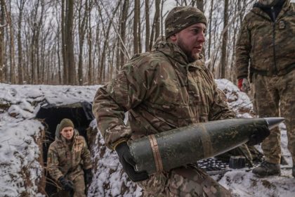 Ukrainian military carry ammunition in a forest in Kharkiv Oblast, Ukraine, on February 8.