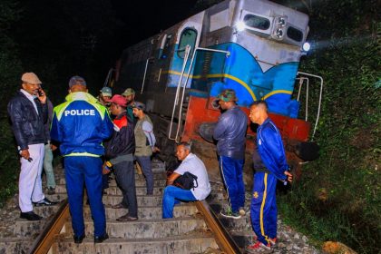 Police and railway personnel examine a derailed train at Habarana in eastern Sri Lanka on February 20, 2025, which killed six elephants.