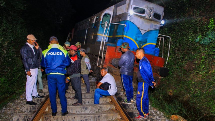 Police and railway personnel examine a derailed train at Habarana in eastern Sri Lanka on February 20, 2025, which killed six elephants.