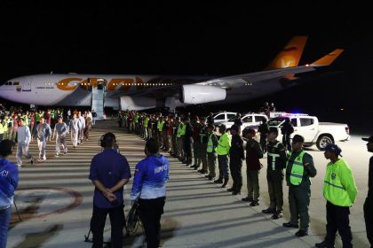 Venezuelan migrants deported from US Naval Station Guantanamo Bay walk down from the Venezuelan Conviasa Airlines plane as they arrive at Simon Bolivar International Airport in Maiquetia, Venezuela, on February 20, 2025.