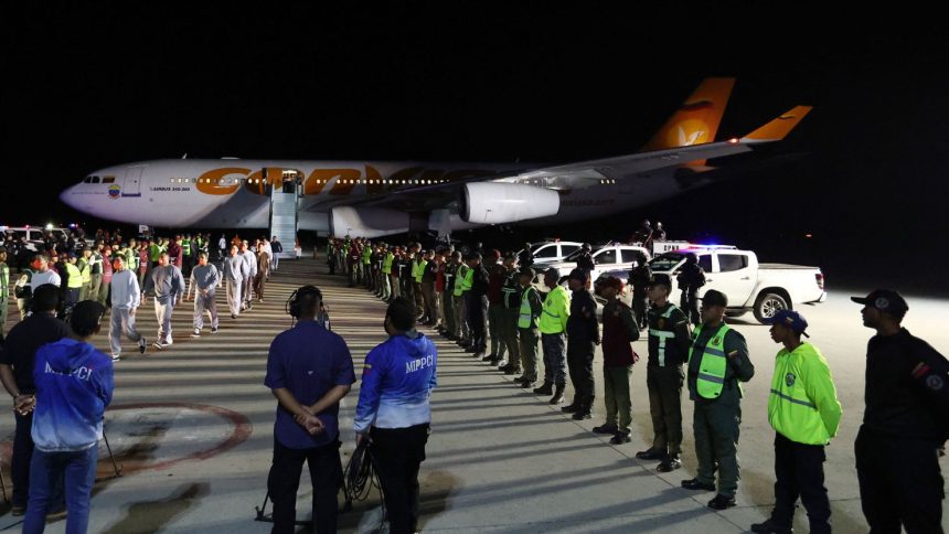 Venezuelan migrants deported from US Naval Station Guantanamo Bay walk down from the Venezuelan Conviasa Airlines plane as they arrive at Simon Bolivar International Airport in Maiquetia, Venezuela, on February 20, 2025.