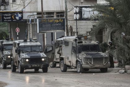 Israeli soldiers block a road during a visit by Israeli Prime Minister Netanyahu to Tulkarm in the occupied West Bank, on February 21.