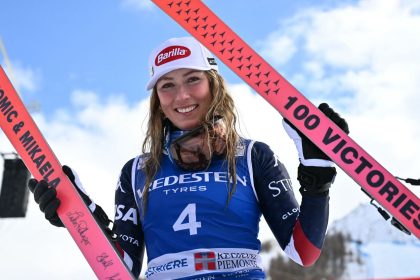 US Mikaela Shiffrin, winner, poses with skis marking her "100 Victories" after the podium ceremony of the Women's Slalom event during the FIS Alpine Skiing World Cup in Sestriere, Italy, on February 23, 2025. US Mikaela Shiffrin won ahead Croatia's Zrinca Ljutic, second and US Paula Moltzan, third. Mikaela Shiffrin takes 100th World Cup skiing win with Sestrieres slalom. (Photo by Marco BERTORELLO / AFP) (Photo by MARCO BERTORELLO/AFP via Getty Images)