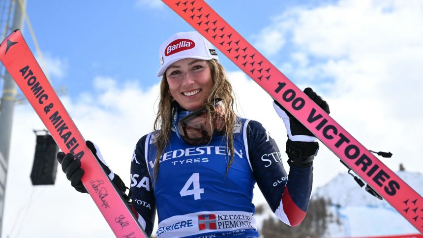 US Mikaela Shiffrin, winner, poses with skis marking her "100 Victories" after the podium ceremony of the Women's Slalom event during the FIS Alpine Skiing World Cup in Sestriere, Italy, on February 23, 2025. US Mikaela Shiffrin won ahead Croatia's Zrinca Ljutic, second and US Paula Moltzan, third. Mikaela Shiffrin takes 100th World Cup skiing win with Sestrieres slalom. (Photo by Marco BERTORELLO / AFP) (Photo by MARCO BERTORELLO/AFP via Getty Images)