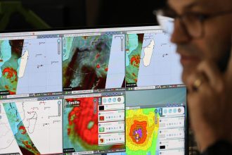 Meteo-France operational meteorologists monitor tropical cyclone "Garance" approaching French overseas territory island of La Reunion, in Saint-Denis de la Reunion on February 26, 2025.