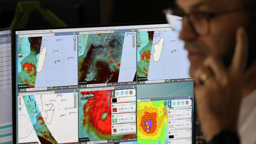 Meteo-France operational meteorologists monitor tropical cyclone "Garance" approaching French overseas territory island of La Reunion, in Saint-Denis de la Reunion on February 26, 2025.