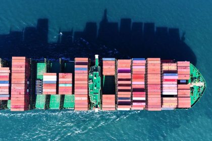 A cargo ship loaded with foreign trade containers sails out of the port of Qingdao in Shandong province, China, on February 17, 2025