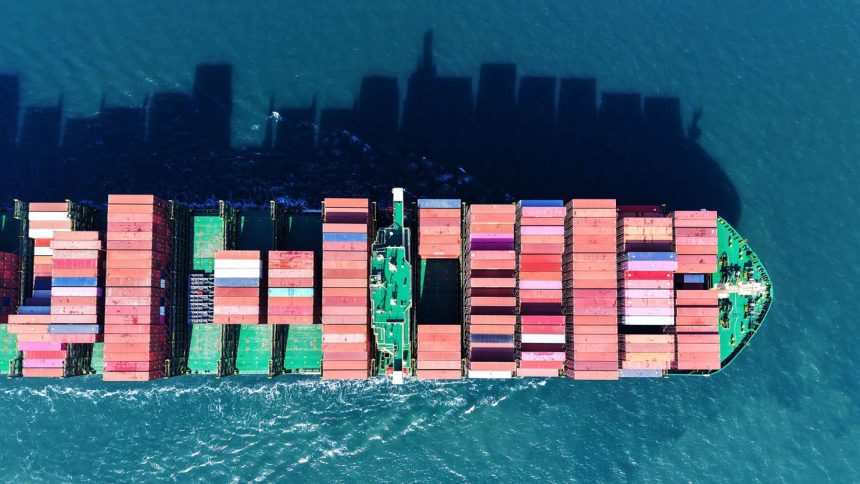 A cargo ship loaded with foreign trade containers sails out of the port of Qingdao in Shandong province, China, on February 17, 2025