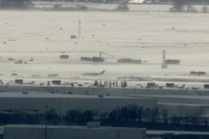 Crews work on the scene of an incident at Toronto Pearson International Airport in Toronto, Ontario, on Monday, February 17, 2025.