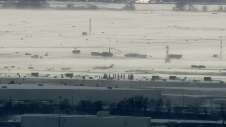 Crews work on the scene of an incident at Toronto Pearson International Airport in Toronto, Ontario, on Monday, February 17, 2025.