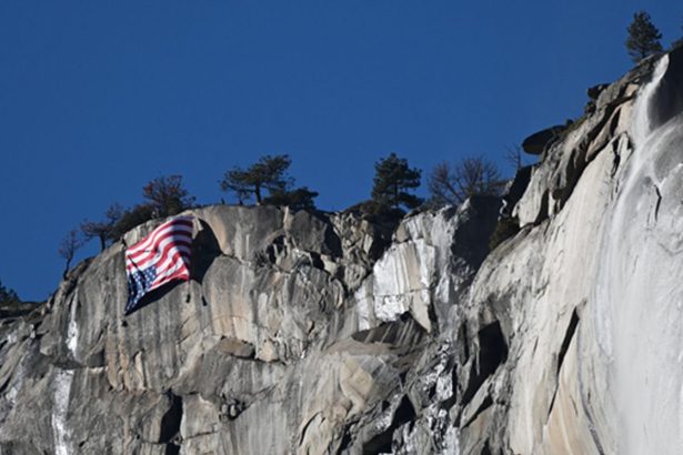 The American flag is seen unfurled upside down at Yosemite National Park, California, on Saturday, February 22, 2025.