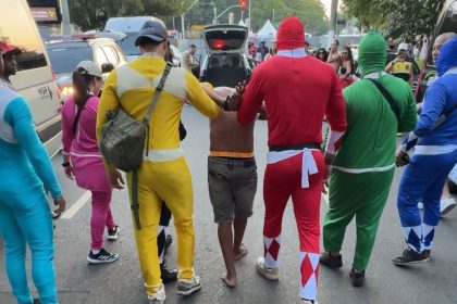 Police in Power Ranger costumes arrest a suspect during Carnival in São Paulo