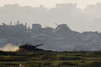 A tank maneuvers inside Gaza, as seen from Israel's border with Gaza, on Wednesday.