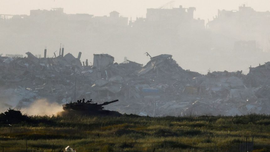 A tank maneuvers inside Gaza, as seen from Israel's border with Gaza, on Wednesday.