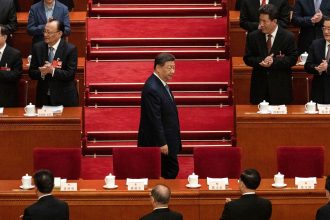 Chinese leader Xi Jinping arrives at a plenary session of the National People's Congress at the Great Hall of the People in Beijing on March 8.