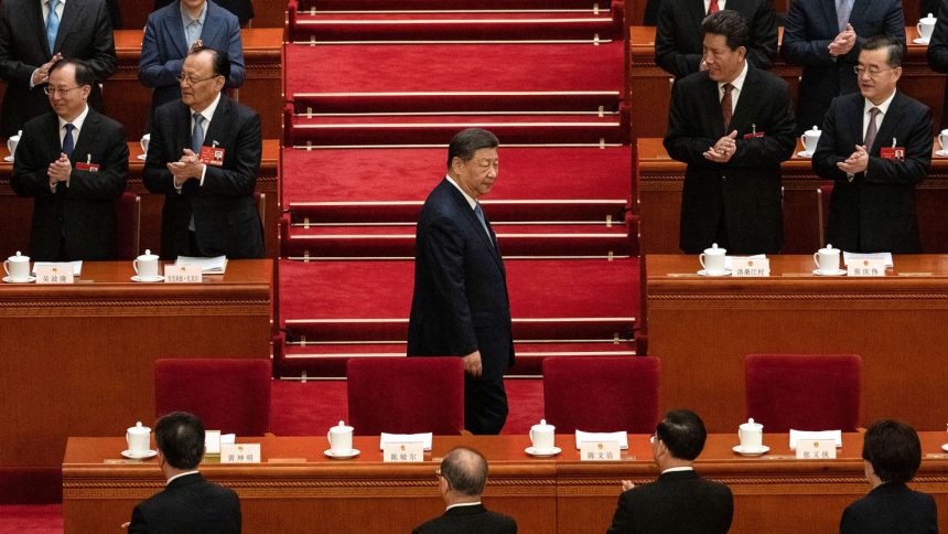 Chinese leader Xi Jinping arrives at a plenary session of the National People's Congress at the Great Hall of the People in Beijing on March 8.