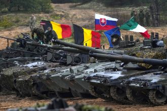 Tanks and military vehicles during a live fire exercise in Adazi, Latvia on November 15, 2022.