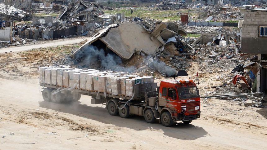 A truck carrying aid drives in Rafah in the southern Gaza Strip, on February 16, 2025.