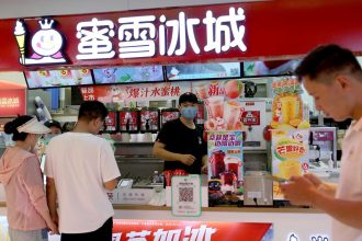 Customers wait at a Mixue Bingcheng bubble tea store at a shopping mall in Beijing, China last year.