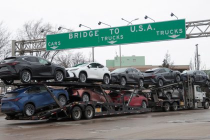 A car hauler drives towards the Ambassador Bridge to Detroit, Michigan from Windsor, Ontario, Canada, March 4, 2025.