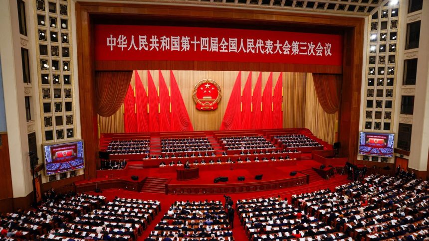 Chinese Premier Li Qiang delivers a speech during the opening session of the National People's Congress at the Great Hall of the People in Beijing on March 5, 2025.